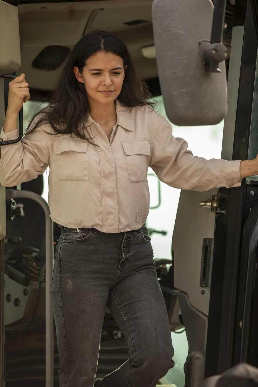 Operator at the controls of a heavy machine on a job site