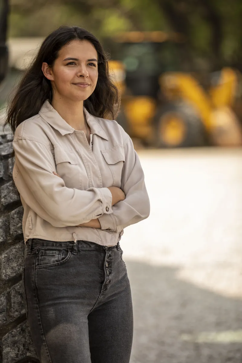 Portrait of an operator in a tan shirt looking off-camera